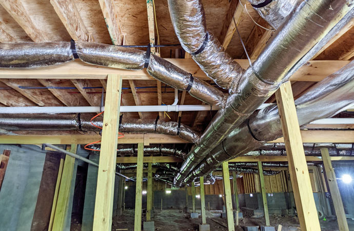 Insulation being added to a vented crawl space